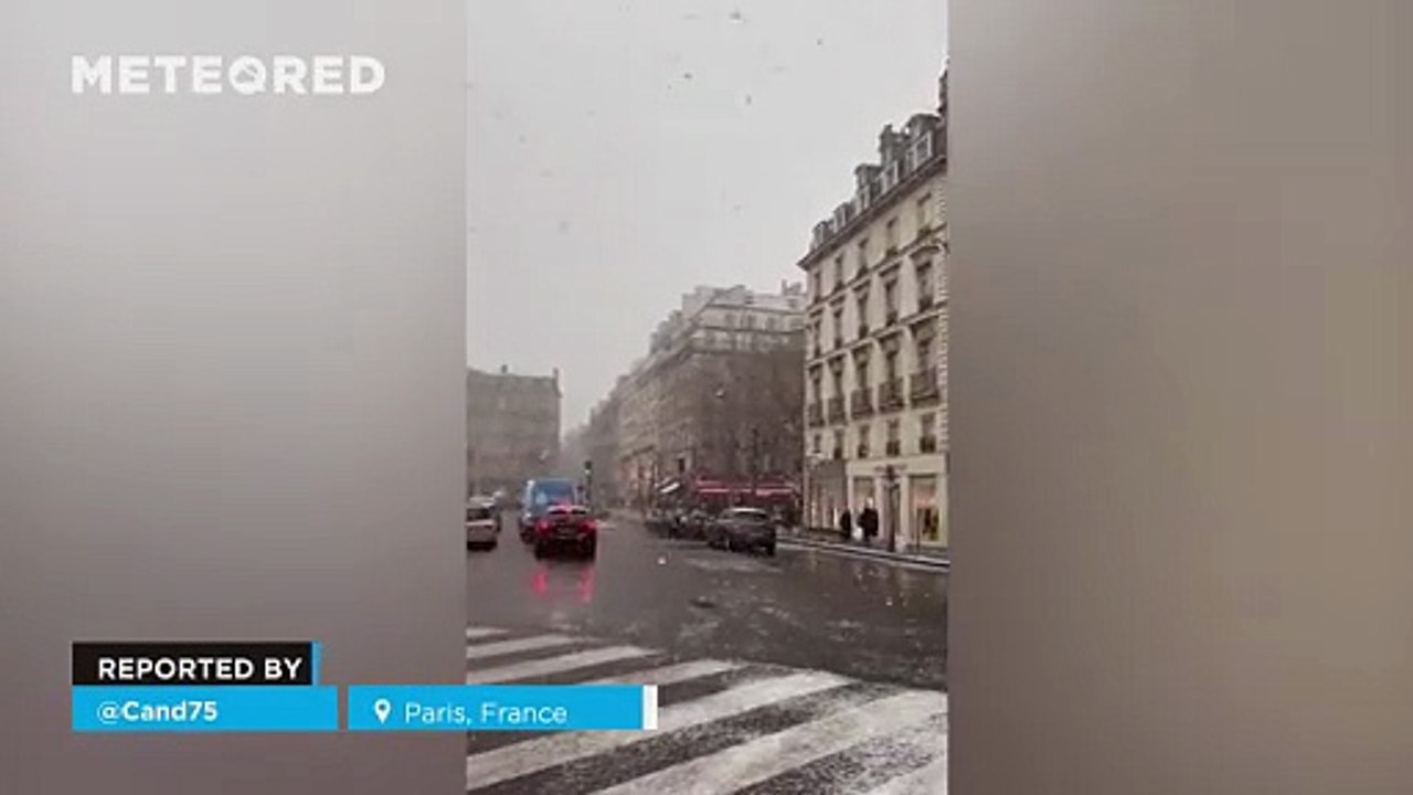 The snow blankets the streets of downtown Paris...