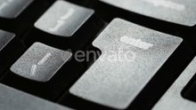 Finger Presses Enter Key on Laptop Keyboard