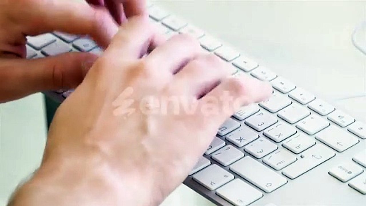 Hands Typing on White Wireless Keyboard