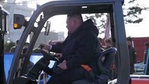 North Korea leader Kim Jong Un drives pallet truck to plant tree at memorial service