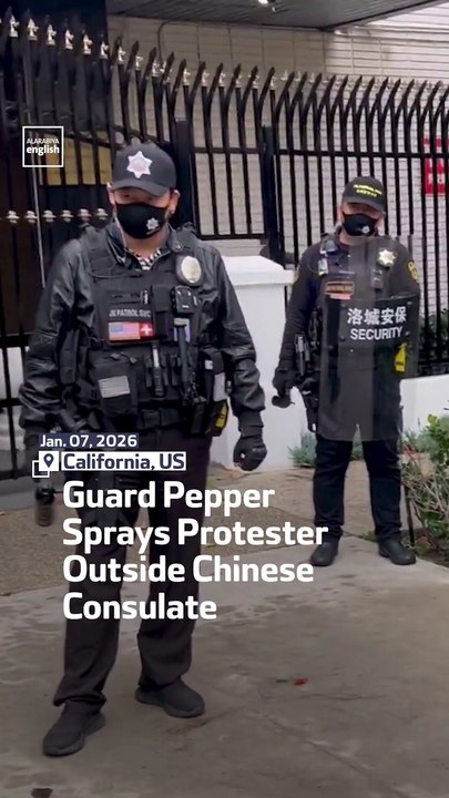 Guard Pepper Sprays Protester Outside Chinese Consulate