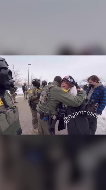 Border Patrol Agent Hugs Protester Amid ICE Tensions