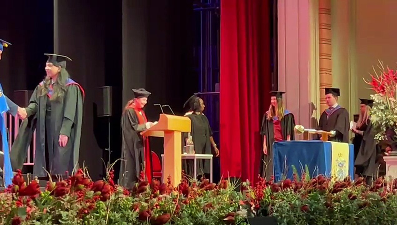 Farnham woman graduates in law with medical alert dog by her side