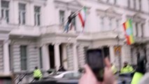 Protester swaps out Iran's flag on top of London embassy