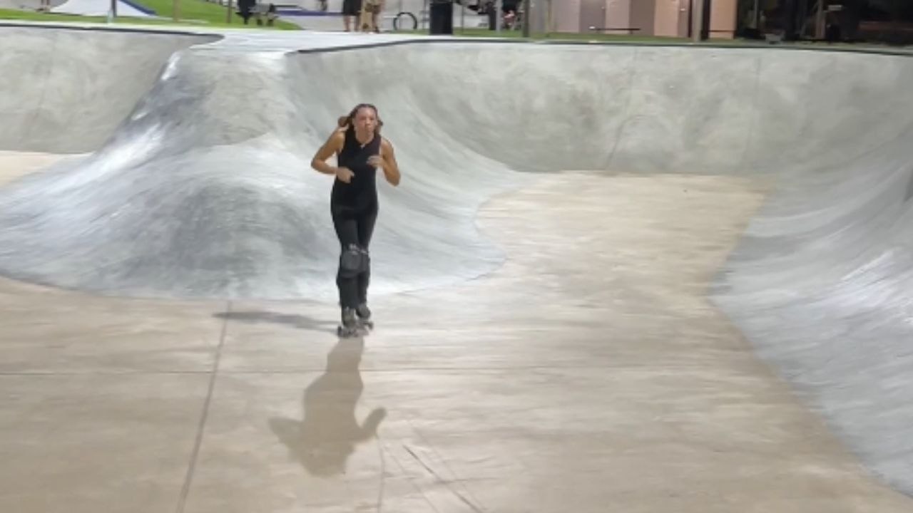 Girl dives into the bowl and wraps it with a flip outside the bowl