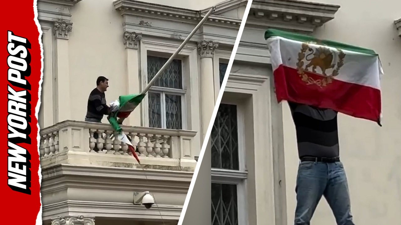 Iranian flag ripped down during protest at London embassy