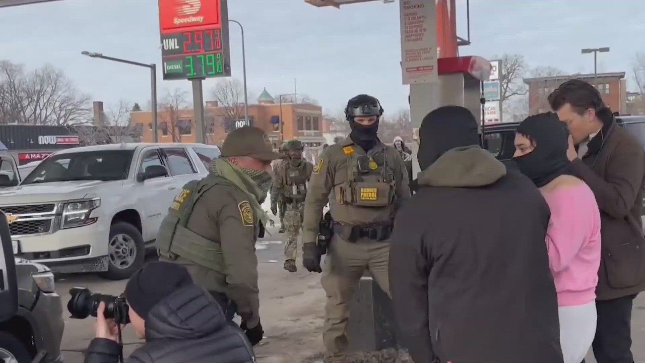 Border Patrol agents tackle an Anti-ICE Protester while conducting operations at a gas station in St Paul, Minnesota