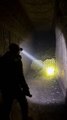 A lone explorer steps into a forgotten underground cave…