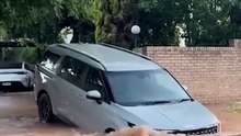 Hire car almost swallowed by enormous sinkhole