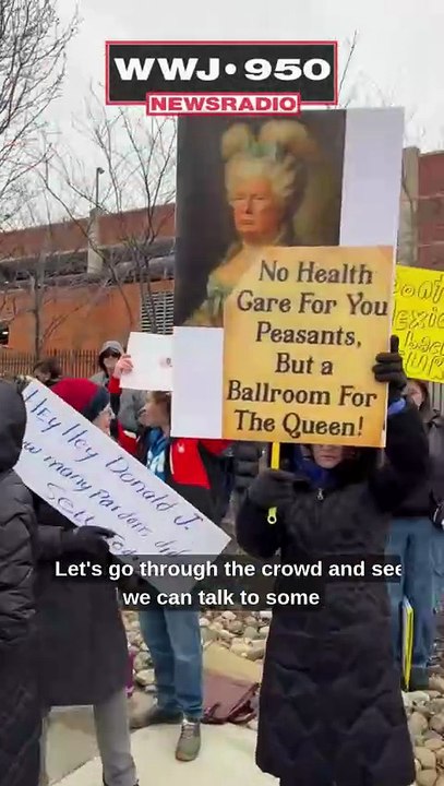 Protesters gather to speak against Trump during Detroit visit