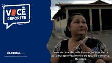 Dona de casa Maria da Conceição Silva alerta para buraco e vazamento de água no Conjunto Mendara