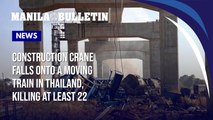 A construction crane falls onto a moving train in Thailand, killing at least 22 people