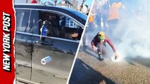 ICE agents drop tear gas from moving car to disperse protesters in Minneapolis
