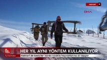 Hakkari’de besiciler karda kızakla hayvanlarına ot taşıyor