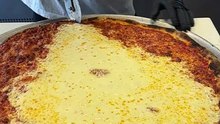 The worlds largest and cheesiest slice