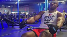 Gentleman pushes through a rowing workout before the machine snaps and throws him backward