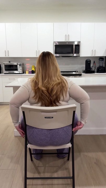girls try to sit on chair but