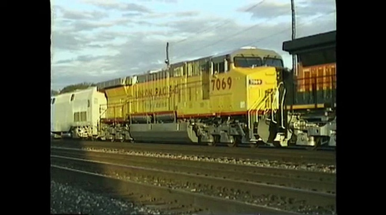 NEW GE Locomotives idling at CP85. Erie, Pennsylvania. Date 9-29-96. Time 6_25 pm.