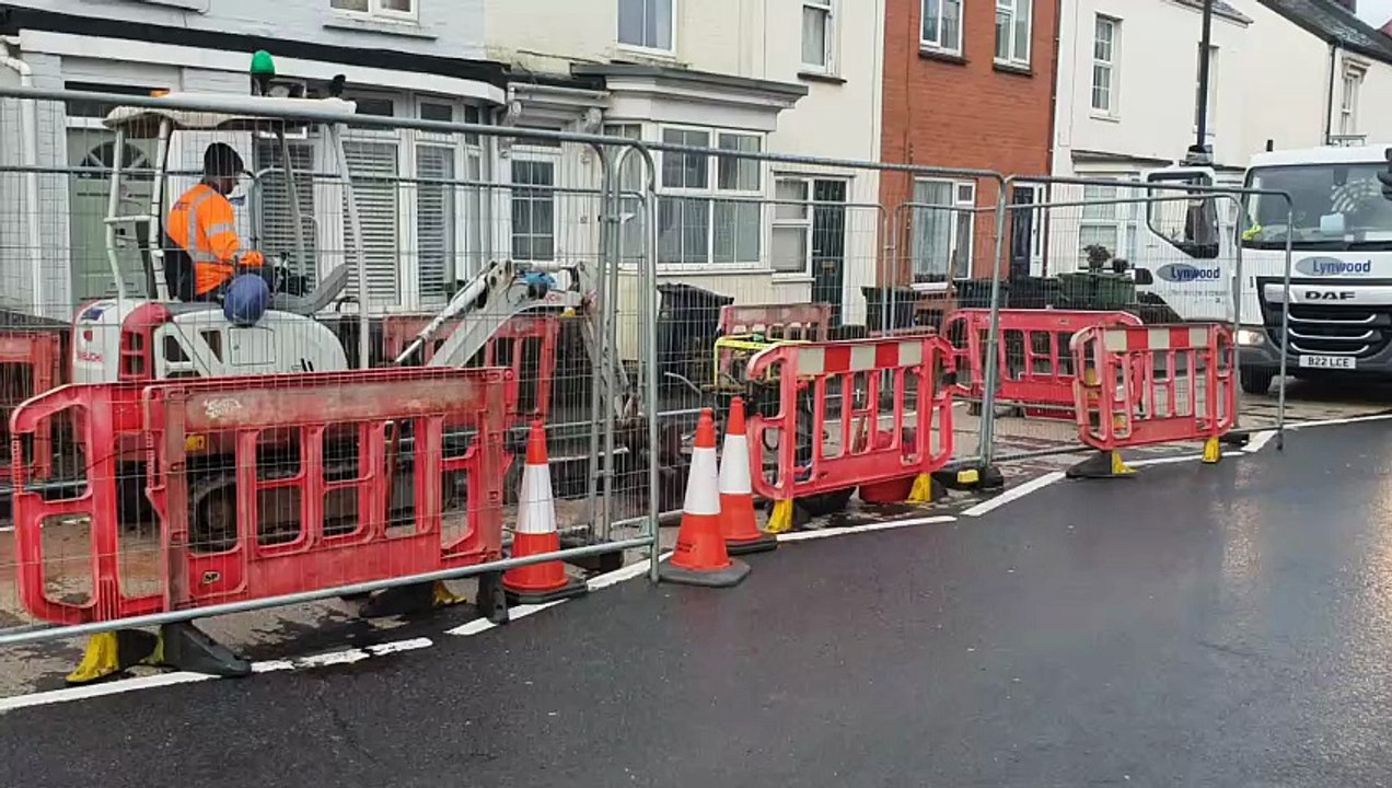 Wessex Water engineers working to repair a burst sewage pipe which flooded the basement of a house in Wellington.