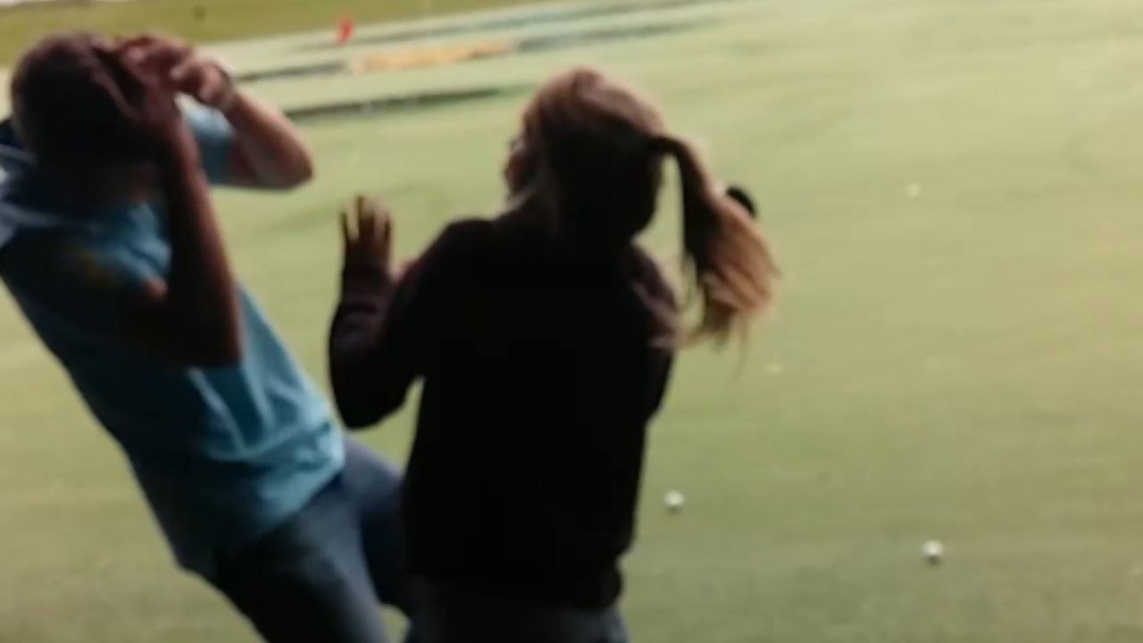 Boy teaches his sister to swing a golf club and gets hit hard