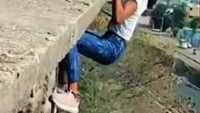 Shocking Incident | Woman Hanging From Building Holding Man’s Hand