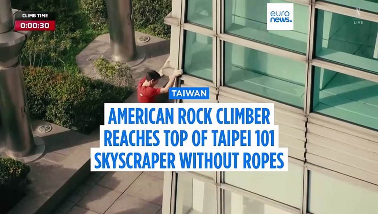 US rock climber Alex Honnold reaches top of Taipei 101 skyscraper without ropes