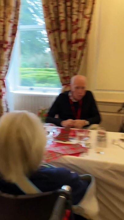 Glaswegian bagpiper Jen Botterill addresses the haggis for Nynehead Court's Burns lunch, filmed by Alain Lockyer.