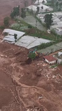 Dramatic drone footage shows homes buried after massive landslide in Indonesia