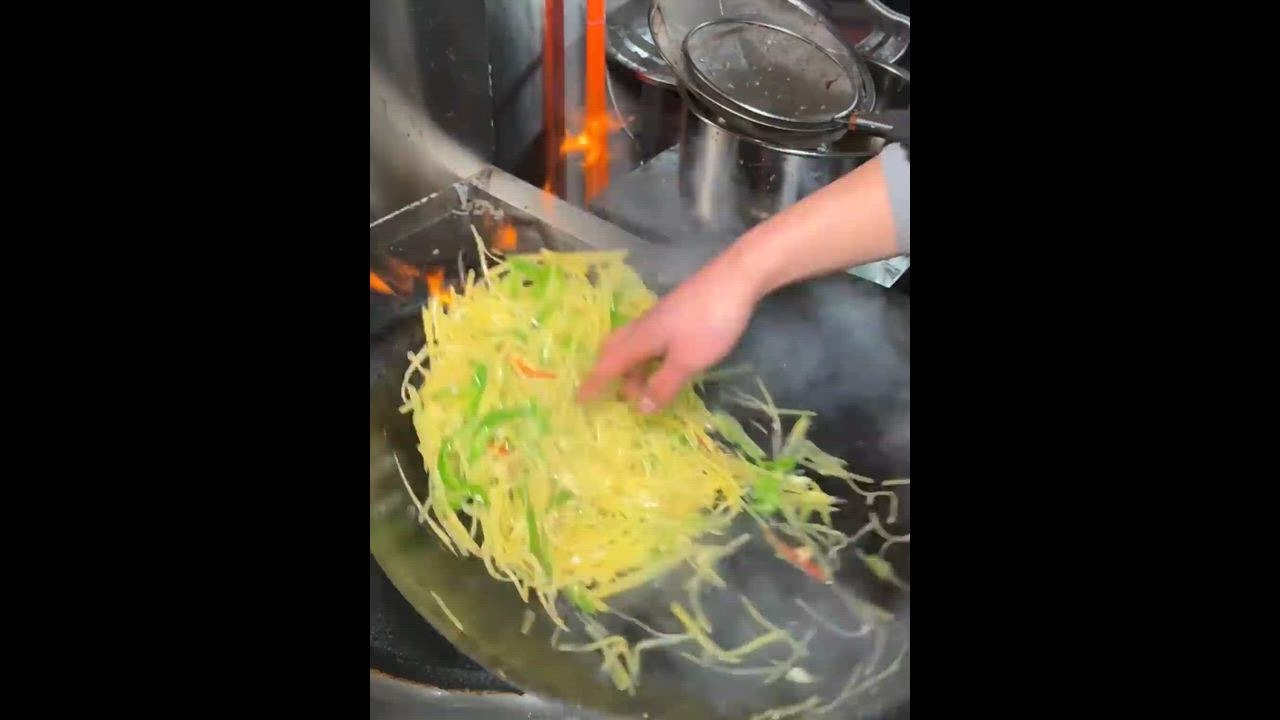 China: Chinese man shows extreme heat tolerance by stir frying with bare hands
