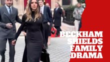 Victoria Beckham looks lost as David Beckham shields his family