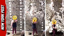 Young girl topples Guinness World Record tower made of 63,000 beer coasters