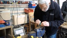 Alton Men's Shed member John Sills prepares a replacement wooden peg for a shelving unit