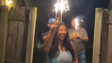 Sparkler slips from a girl's hand and almost lights her up during birthday celebration