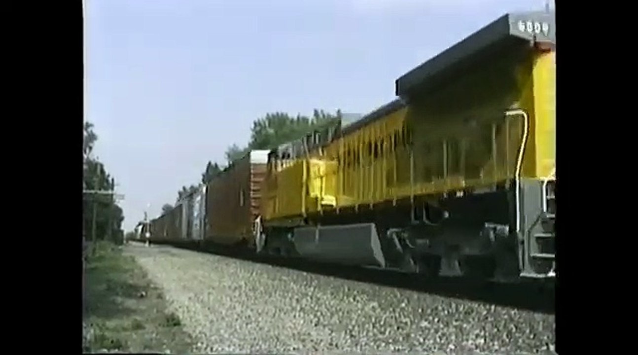 Conrail train BUEL with 2 New UP AC4400CW westbound at Unionville, Ohio. Date 6-8-96. Time 4_45pm.