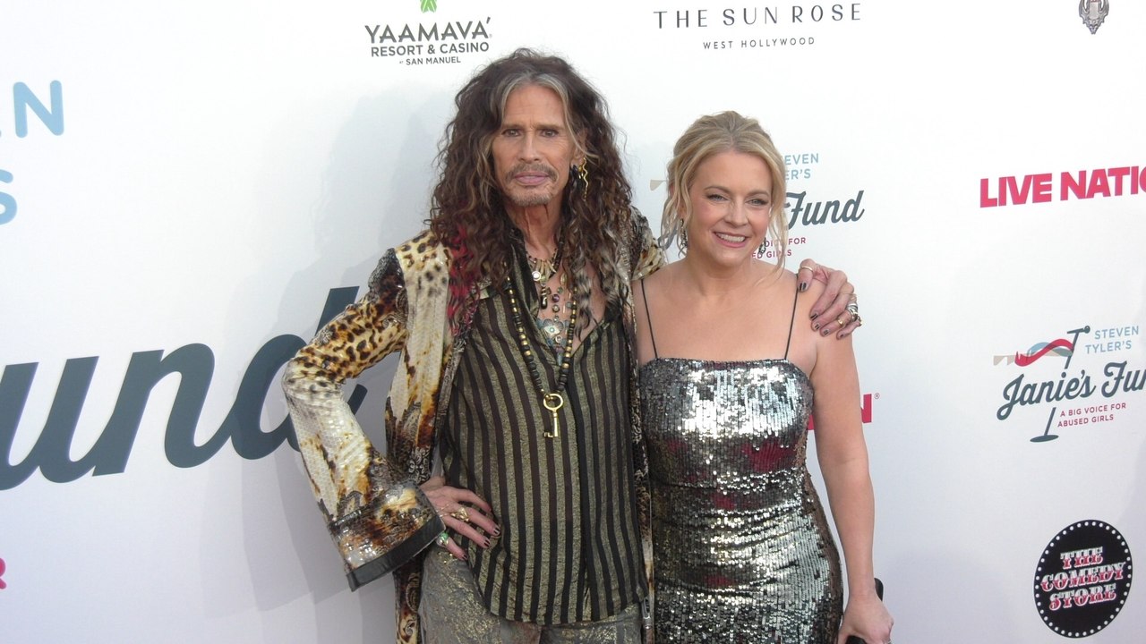 Steven Tyler and Melissa Joan Hart on the red carpet at Steven Tyler's 7th annual GRAMMY Awards viewing party