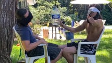 Best friends attempt a blindfold bottle swing challenge that quickly turns into comic mayhem