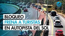 Bloqueo en Autopista del Sol frena regreso de turistas; exigen retiro de autodefensas en Guerrero