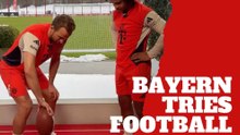 Bayern Munich stars Harry Kane and Serge Gnabry try to spin a football