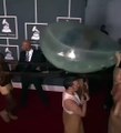 Lady Gaga arrives at the Grammys in 2011 inside a demonic egg carried by slaves who appear to have Satan horns growing in