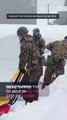 Soldiers, snow plows in Japan battle deadly winter storms