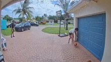 Gentleman nearly falls after his son finally dunks on him at driveway basketball
