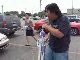 Random Water Gun Fight Outside At A Parking Lot