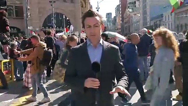 Protesters gather at Flinders Street Station in Melbourne