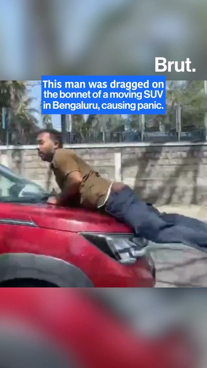 Man clings to bonnet