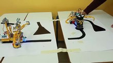Nezha-Microbit Robots Coordinated Barrel Transfer