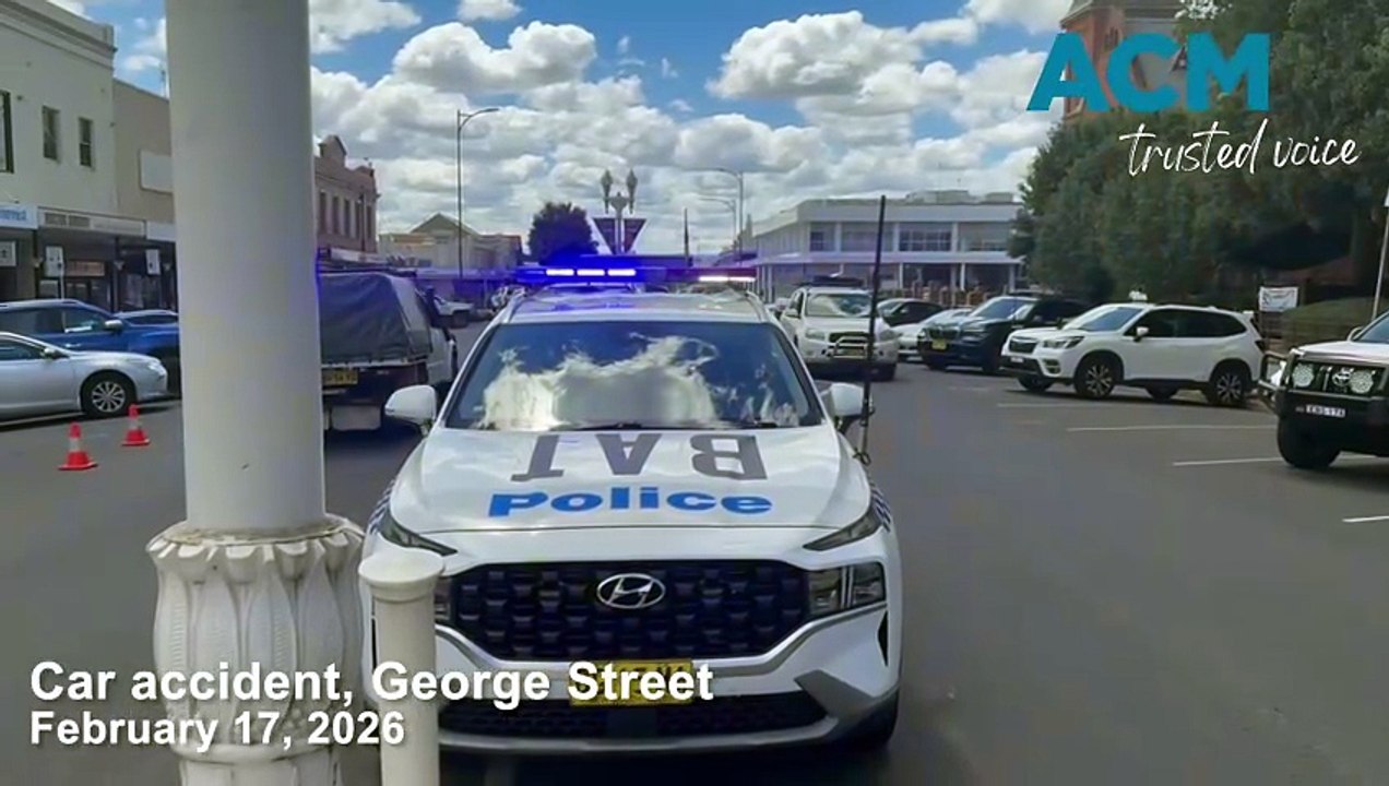 Car reverses through shop window