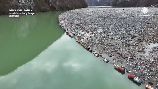Floating trash dump forms on river in Bosnia