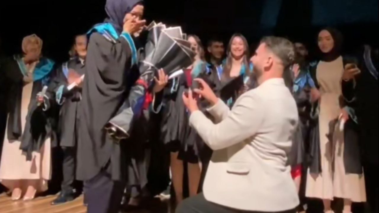 Woman is stunned by a heartfelt marriage proposal that adds new meaning to her graduation day