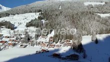 Aerial View Of Holiday Homes, Pine Tree Forest And Mountains In Winter In Langau, Austria.