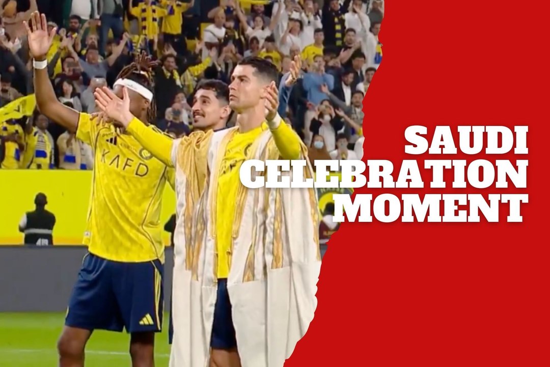 Cristiano Ronaldo celebrates with Al-Nassr fans wearing traditional Saudi attire after the match